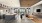 a clubhouse with a kitchen, seating, tables and a tv