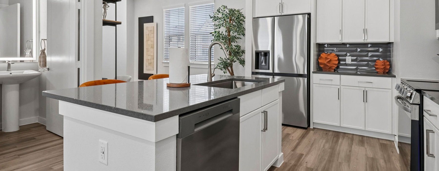kitchen with white cabinets and large island