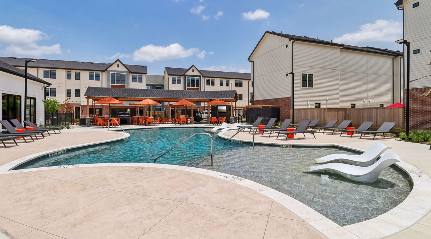 swimming pool behind a building