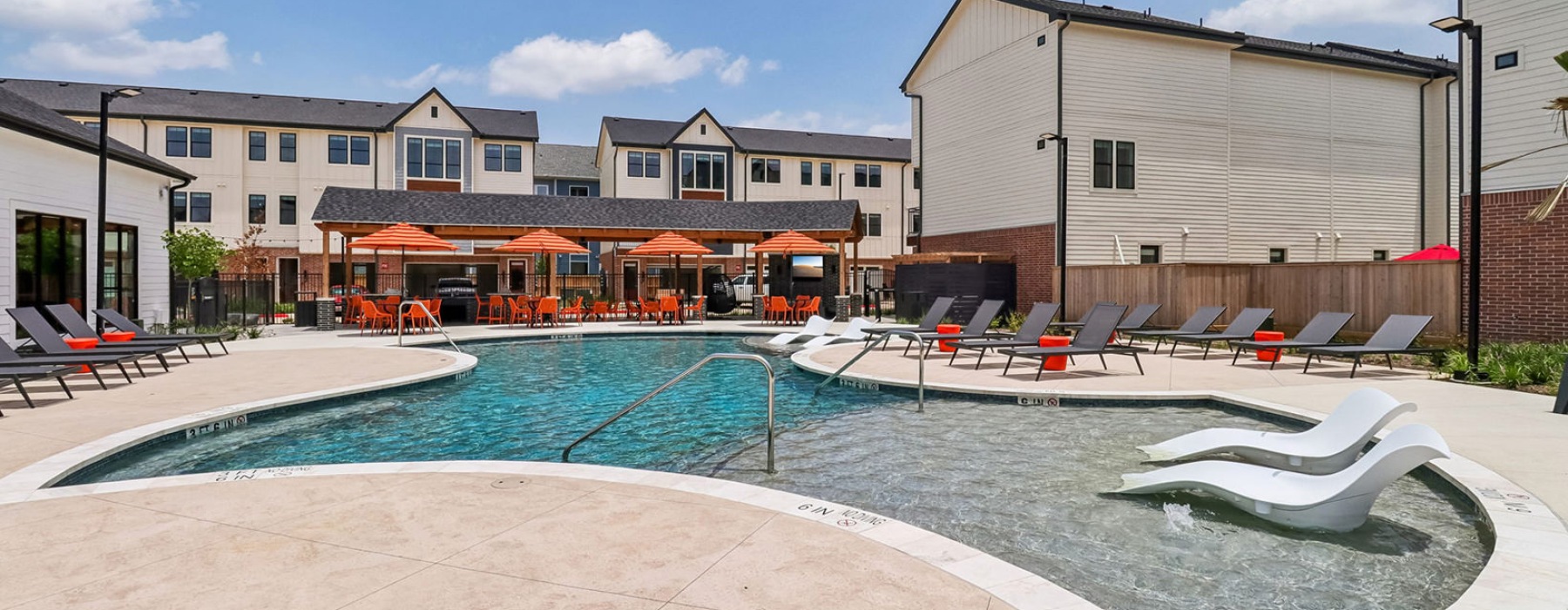 swimming pool behind a building